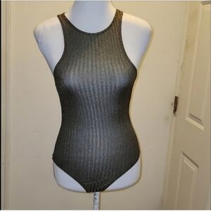 Privacy Please extra small body suit.  it is very stretchy, greenish gold color